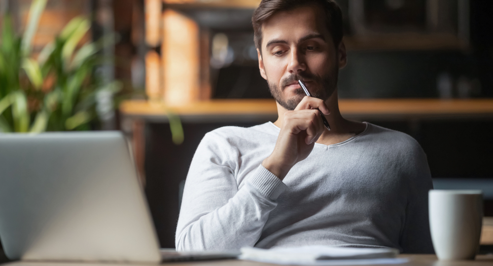 man strategically thinking how to increase web traffic